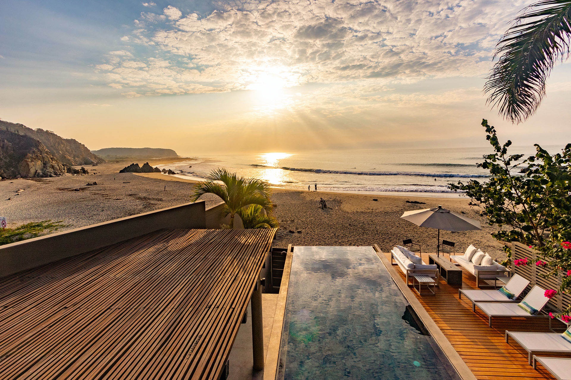 Golden beach where the river meets the ocean at La Bocana, Huatulco